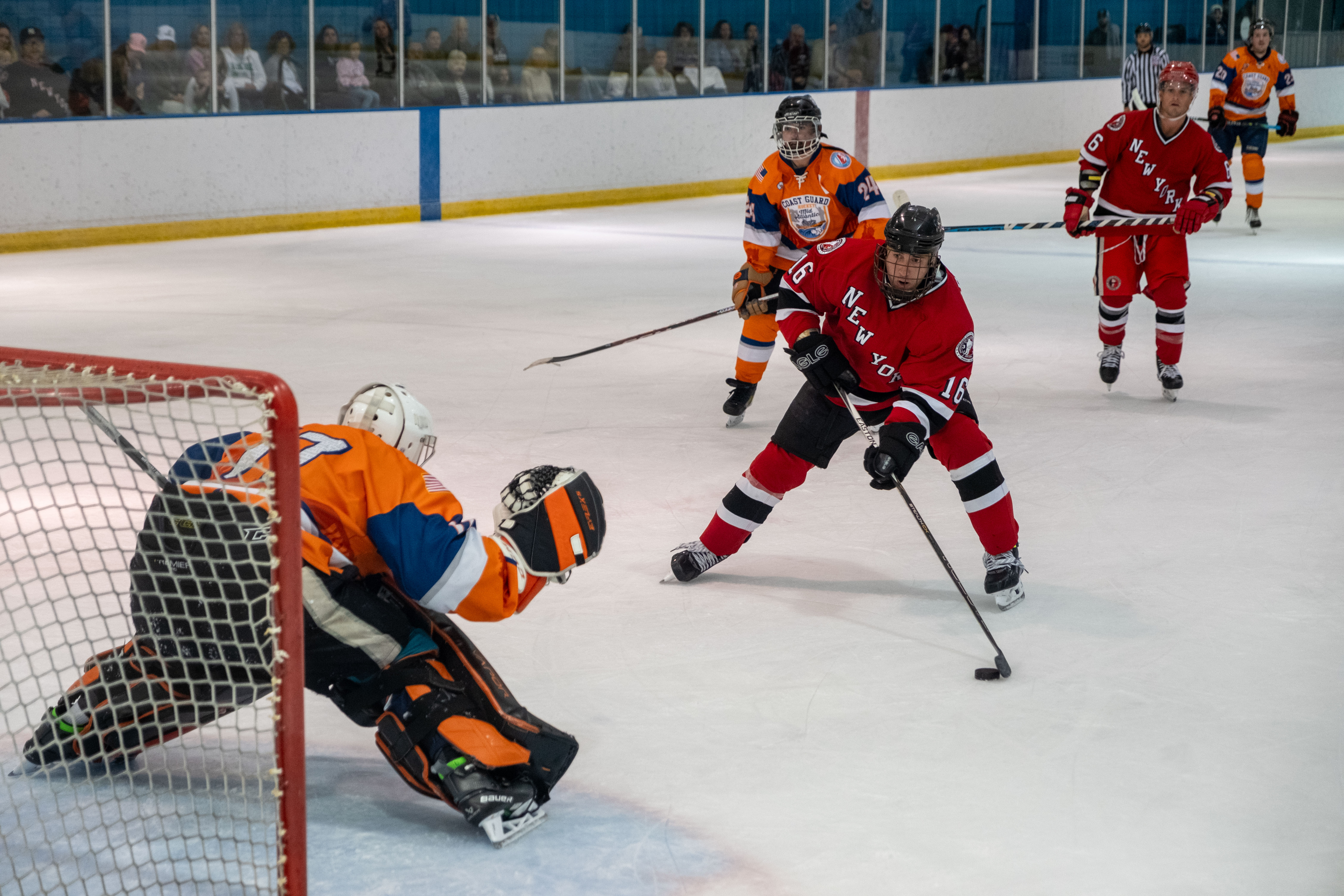 Petty Officer 3rd Class Andrew Slobiski, a Coast Guard aviation maintenance technician at Air Station Atlantic City, blocks a goal during the second game in the 2024 Tunnels to Towers Heroes Cup against the New York City Fire Department (FDNY) on Sept. 14, 2024, in Morristown, New Jersey. The Coast Guard Hockey team claimed victory in the 2024 Tunnels to Towers Heroes Cup representing Coast Guard active duty, reserves, and veterans while raising funds for the Tunnel to Towers Foundation. (Coast Guard photo by Petty Officer 2nd Class Sydney Phoenix)