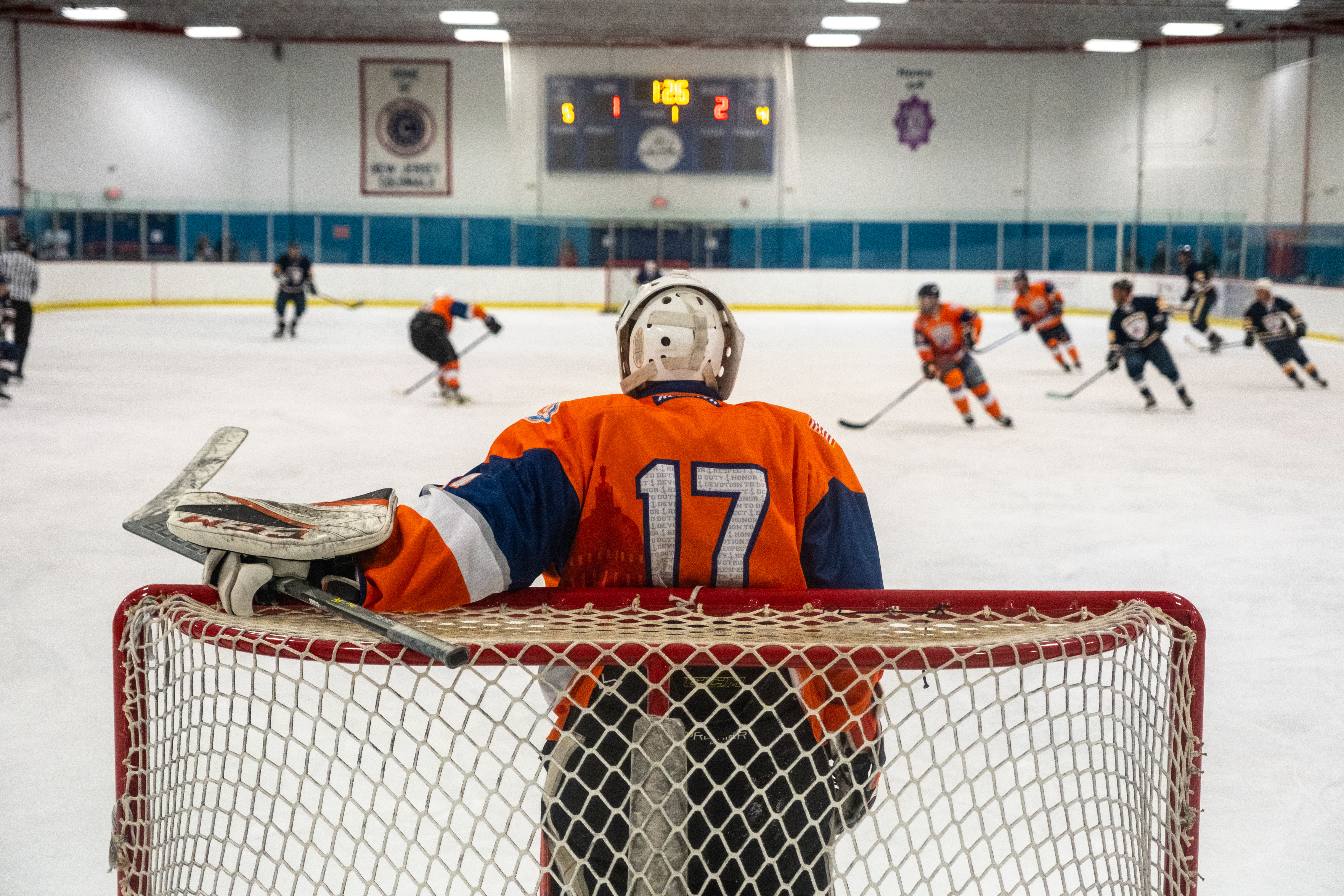 Petty Officer 3rd Class Andrew Slobiski, a Coast Guard aviation maintenance technician at Air Station Atlantic City, stands in the goal during the first game against the Port Authority Police Department (PAPD) on Sept. 14, 2024, in Morristown, New Jersey. The Coast Guard Hockey team claimed victory in the 2024 Tunnels to Towers Heroes Cup representing Coast Guard active duty, reserves, and veterans while raising funds for the Tunnel to Towers Foundation. (Coast Guard photo by Petty Officer 2nd Class Sydney Phoenix)