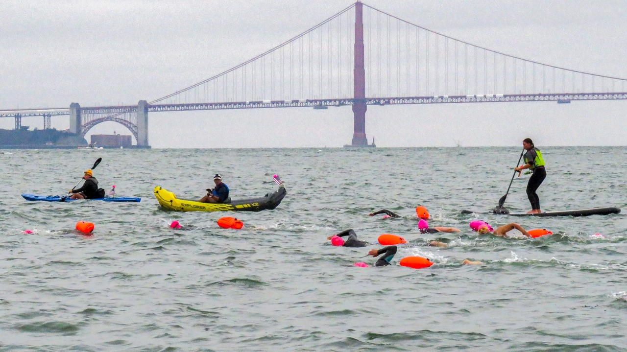 Take the Rock swimmers and the support crew cross the San Francisco Bay during the Alcatraz swim on Sunday, Sept. 26, 2021. Photo by James Leedy