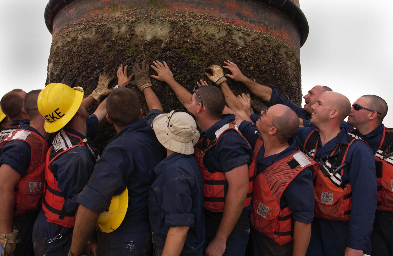 Coast Guard Cutter Walnut’s deck gang posts with a newly raised Iraqi buoy. (Coast Guard Collection)