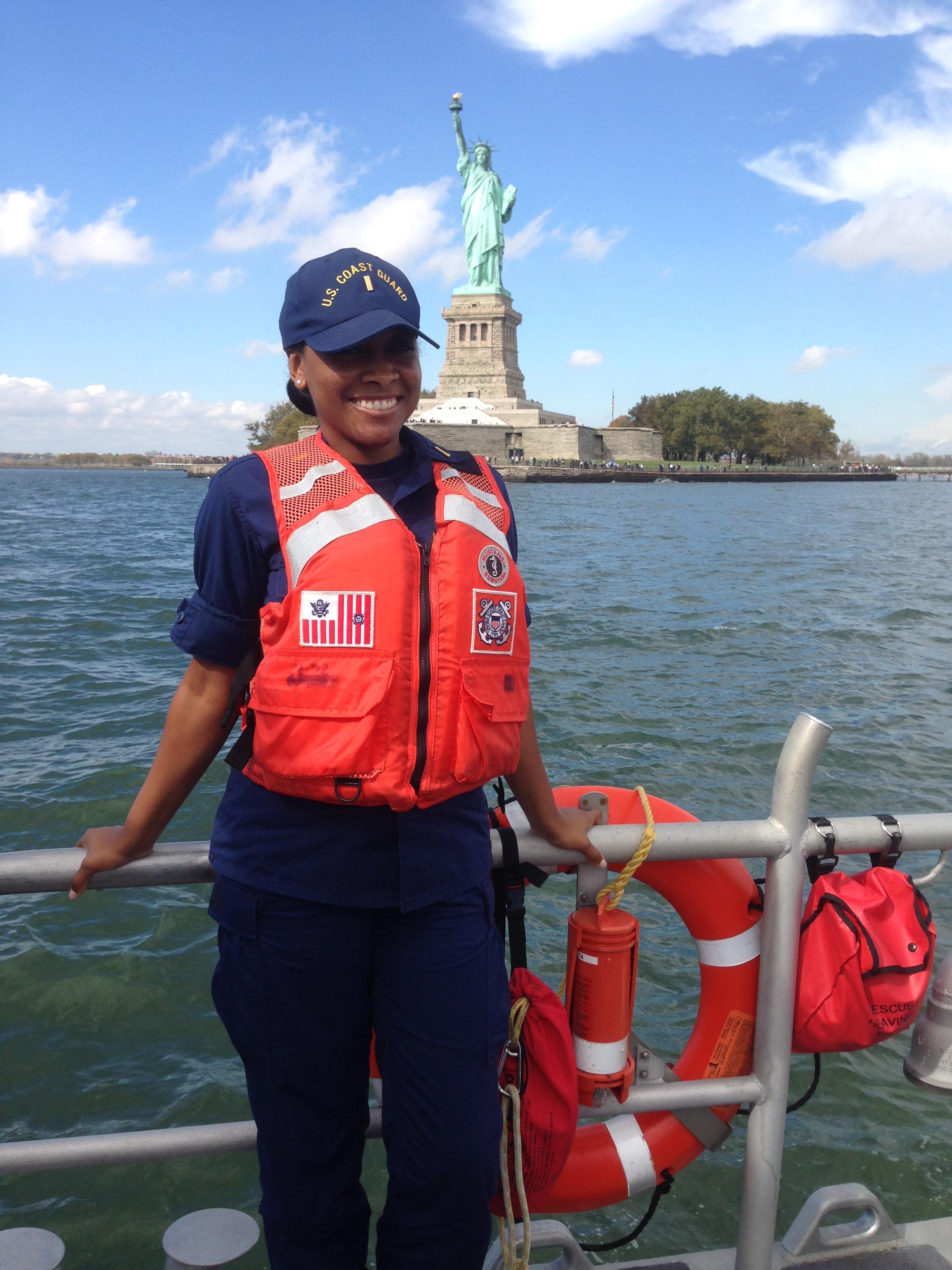 NEW YORK - Ens. Kelly Relf stands on the back of a 45-foot medium response boat in front of the Statue of Liberty in New York Harbor, October 16, 2014. Now Lt. Relf took time Sept. 9, 2020, to interview Capt. Michael Day, who coordinated the Coast Guard's response during 9/11. (U.S. Coast Guard photo)