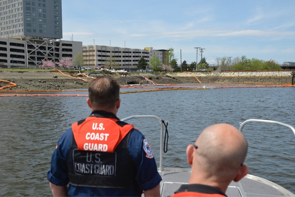 Sector Boston won the 2018 Wallace Award for its response to the accidental discharge of more than 6,500 gallons of dielectric fluid in the Mystic River. A crew from the Atlantic Strike Team survey boom deployed on the Mystic River near the Amelia Earhart Dam Monday, May 7, 2018. The boom is containing dielectric oil coming from nearby storm drains. (U.S. Coast Guard photo by Petty Officer 3rd Class Nicole J. Groll)