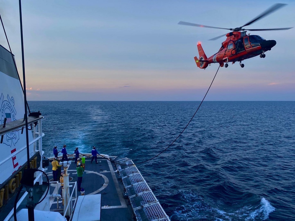 The crew of Coast Guard Cutter Vigilant (WMEC 617) conducting a helicopter  in-flight refueling evolution with a MH-65 assigned to Helicopter  Interdiction Tactical Squadron during flight operations off the coast of St.  Augustine, FL, Sep. 26, 2020. ( U.S. Coast Guard photo) 